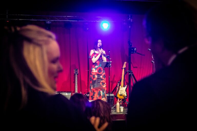 A performer taking part in a hosted open mic night